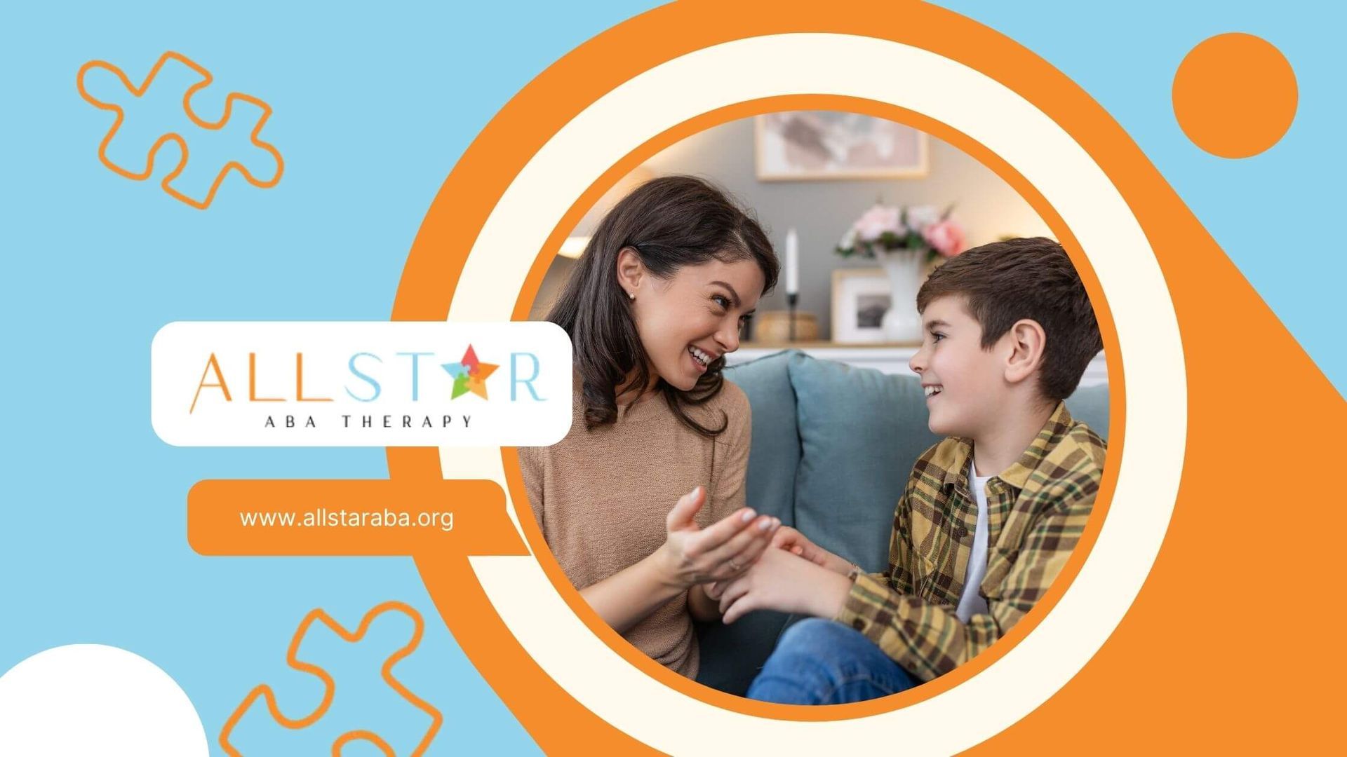 A BCBA and a boy are sitting on a couch talking to each other in ABA therapy.