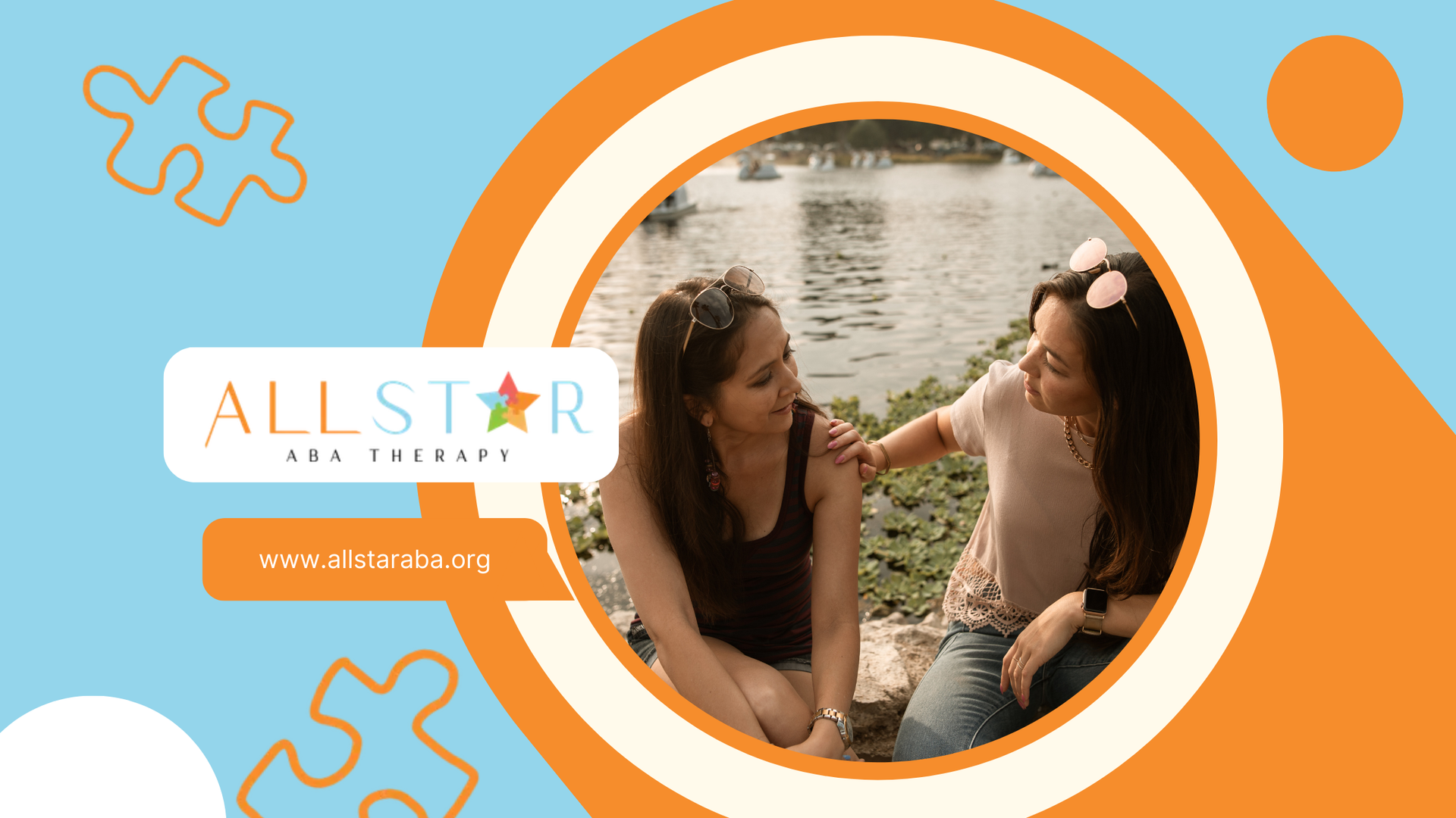 Two women are sitting next to each other in front of a body of water.