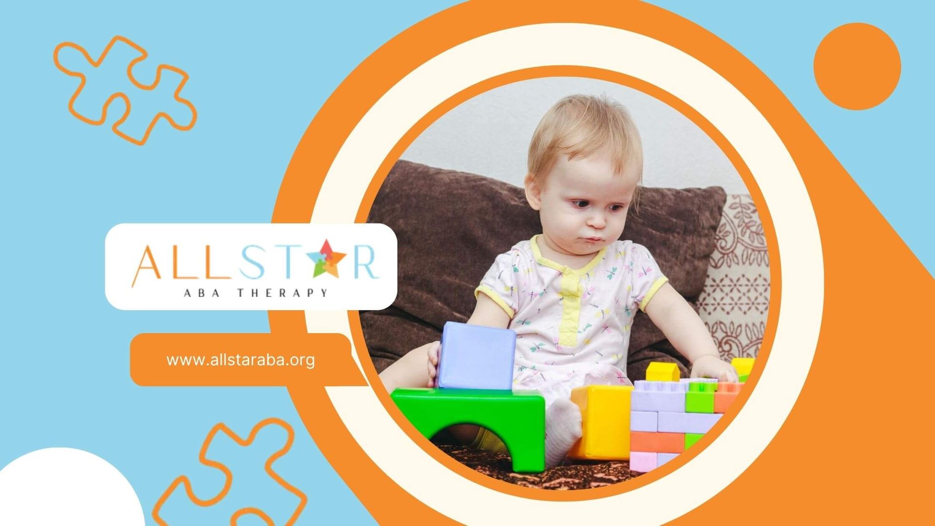 Toddler with autism sitting on a couch, looking at blocks and lego.