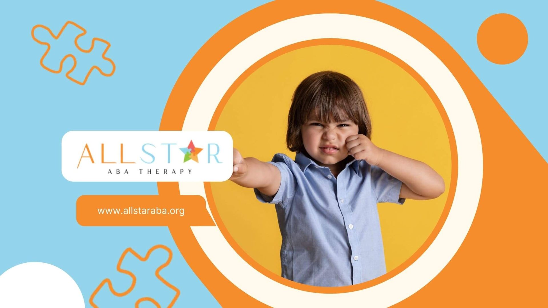 Child making an angry expression with a punching gesture in ABA therapy session.