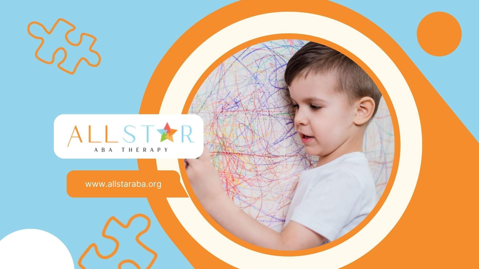 A young boy is drawing on a piece of paper with colored pencils in ABA therapy.