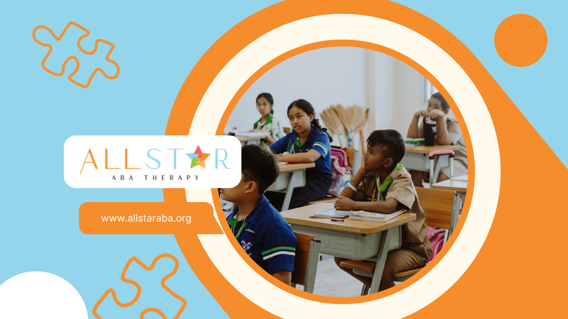 A group of children are sitting at desks in a classroom.
