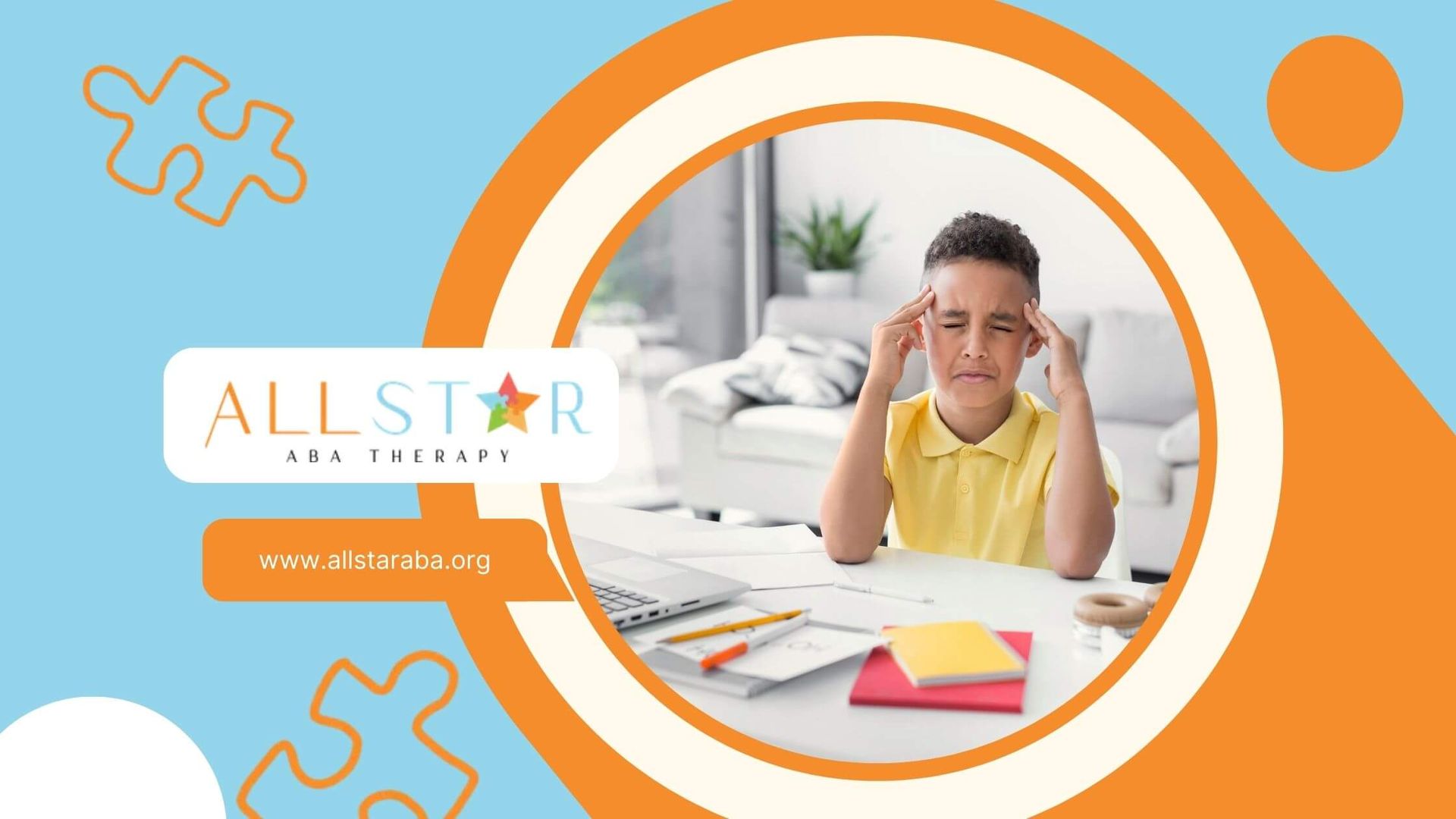 ​A boy holding his forehead, looking distressed and rubbing his temples while sitting at a desk