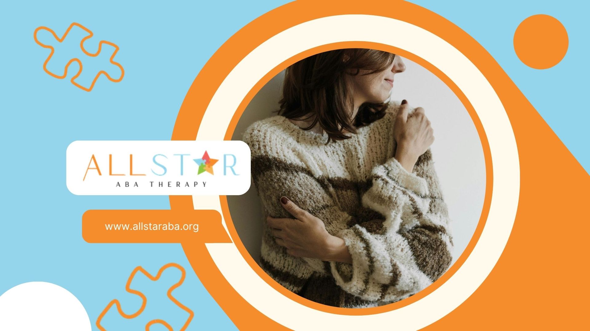 A woman in a sweater is hugging herself in a circle.