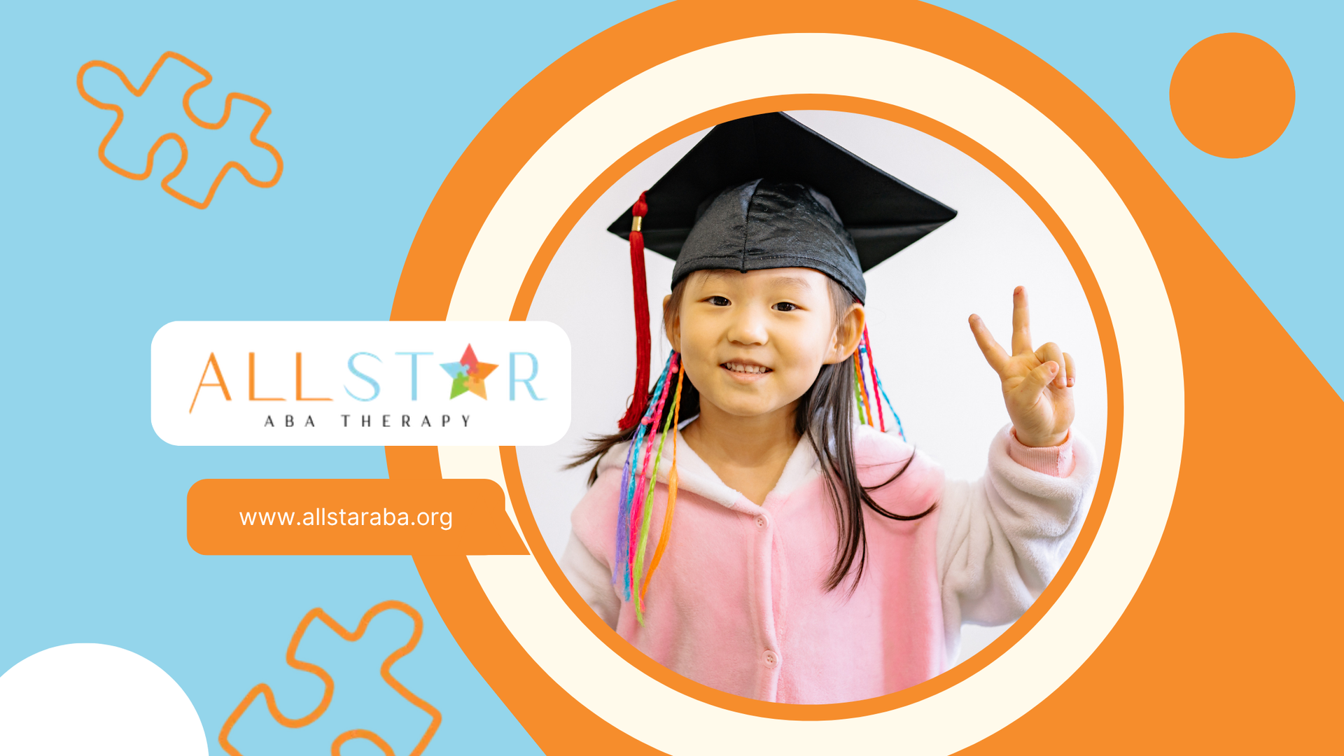 A smiling child in graduation cap and gown making a peace sign.