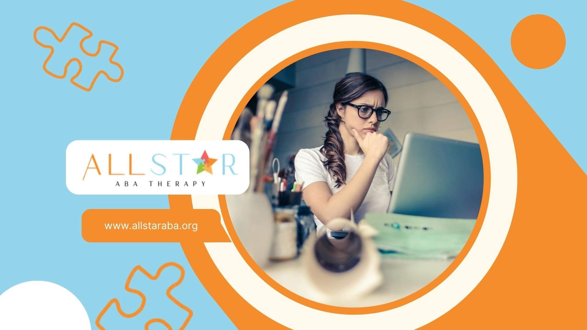 Female therapist wearing glasses concentrating while working on a laptop at a desk in Maryland.