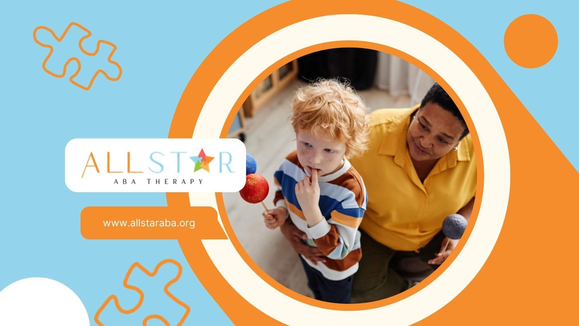 ABA therapist and young boy with autism holding planet models in ABA therapy session.