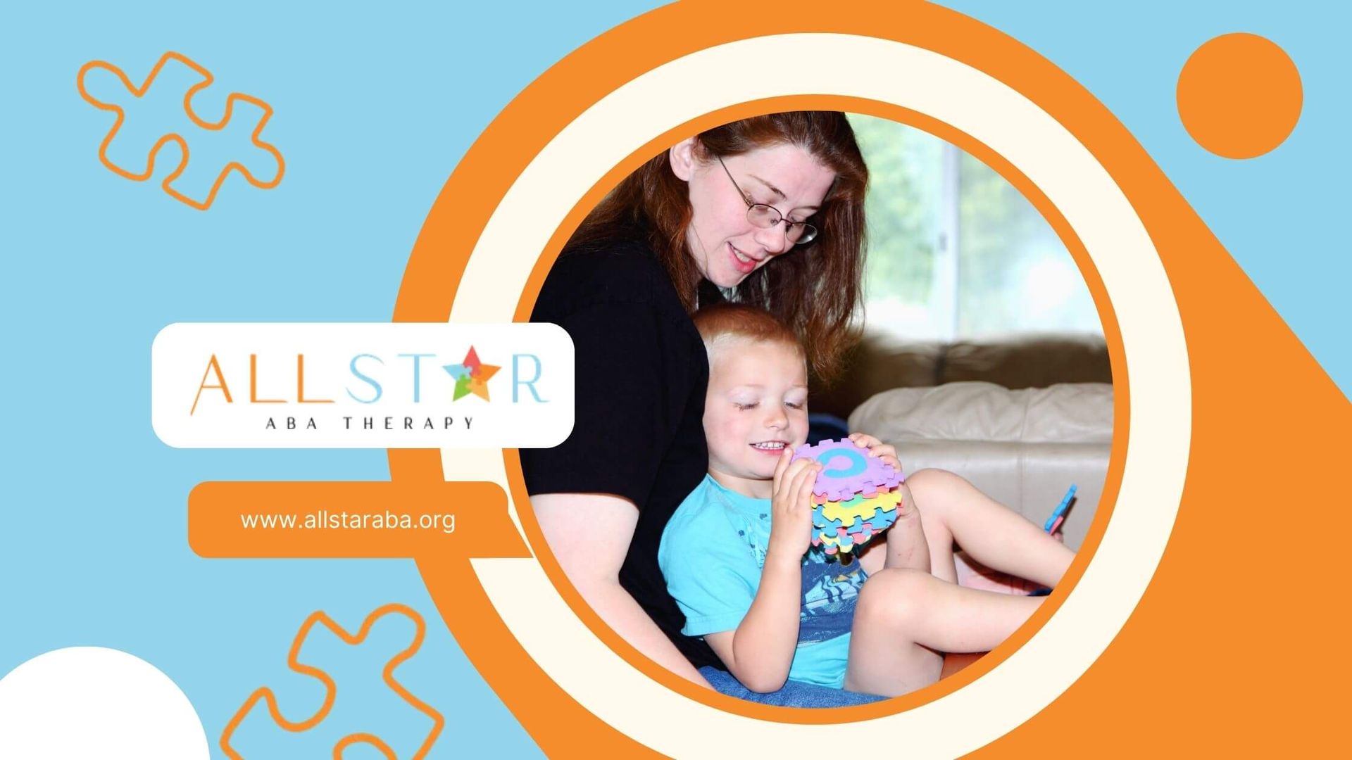 An ABA therapist and son playfully building with colorful puzzle pieces on a table at home.