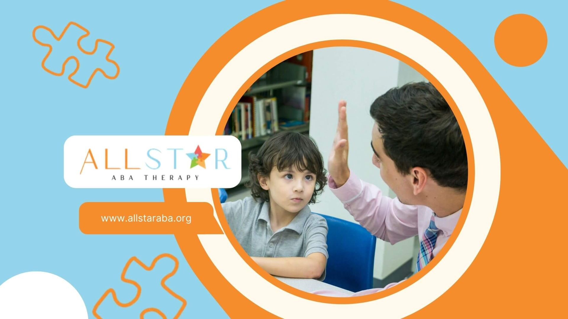 A young boy and a BCBA are high-fiving in a classroom setting.