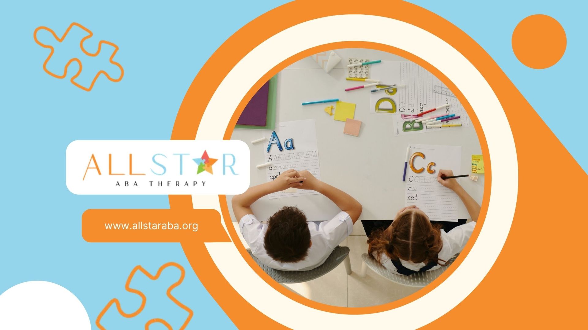 Two children at a white table doing school work with colorful letters and paper.
