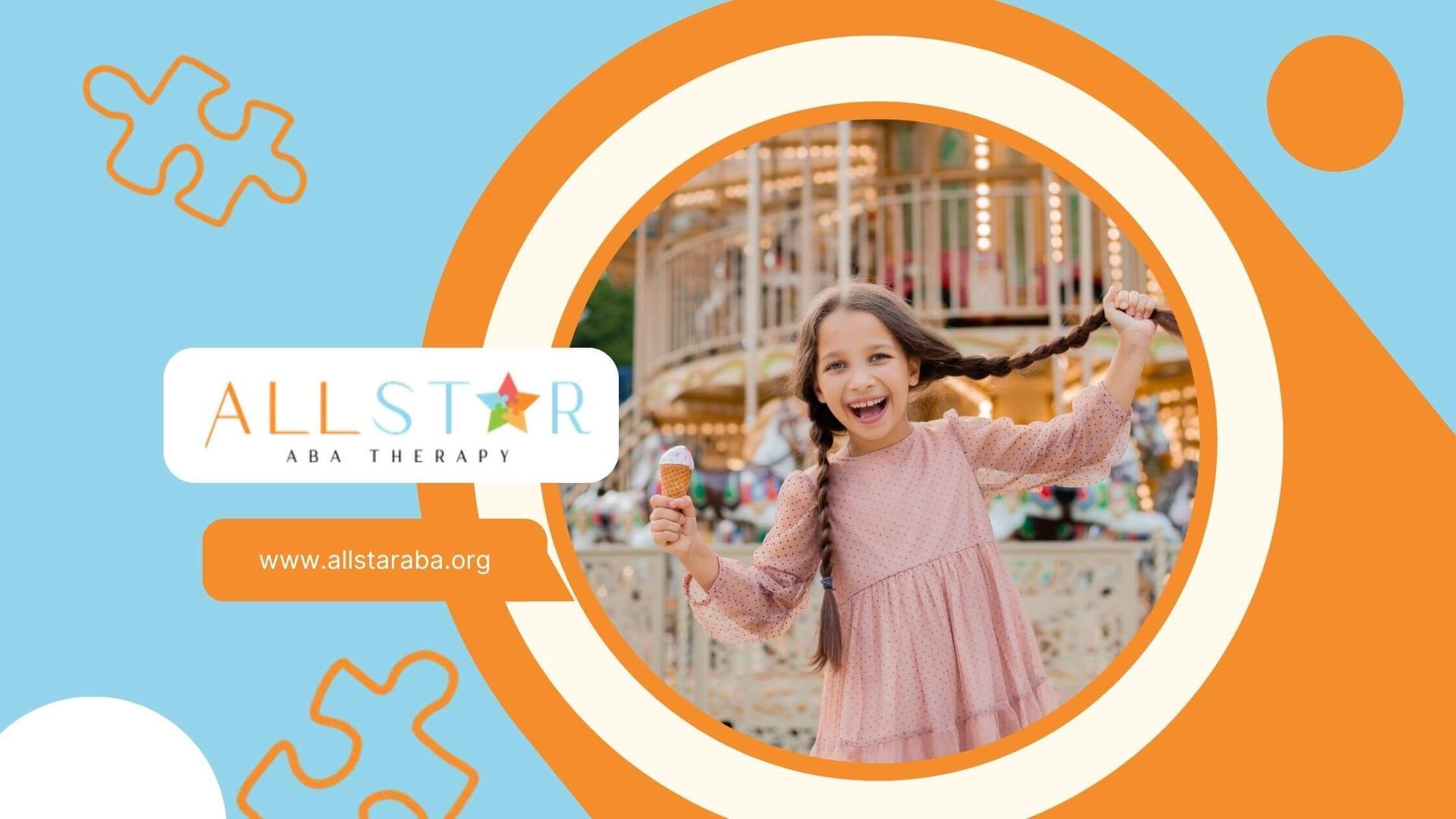 A little girl with autism is holding an ice cream cone in front of a merry go round.