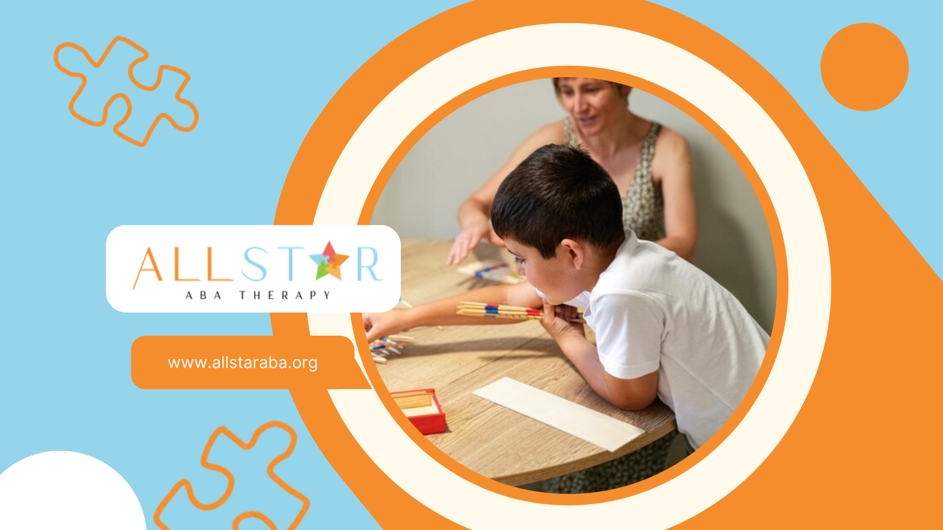 An RBT and a little boy are sitting at a table playing with puzzles during their ABA therapy session