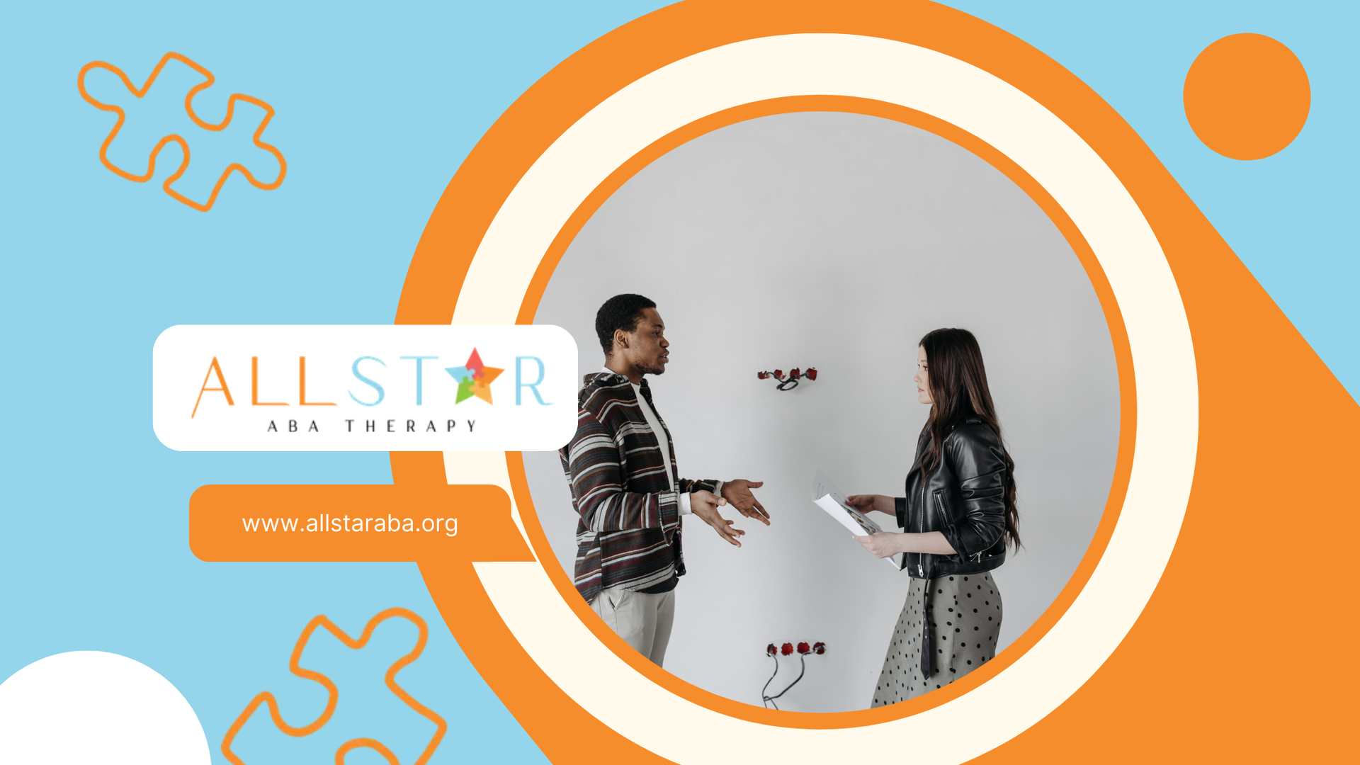 A man and a woman are talking in front of a white board.