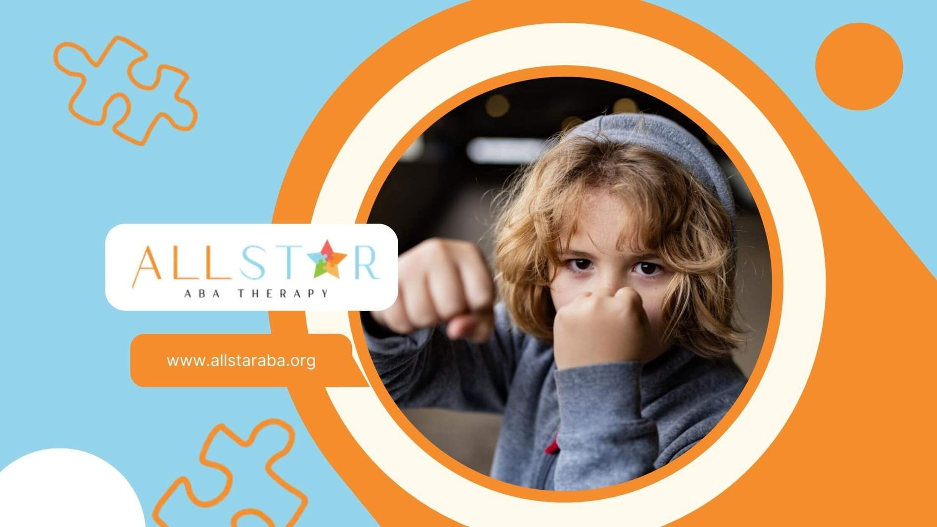 Young child with raised fists showing an aggressive or defensive pose.