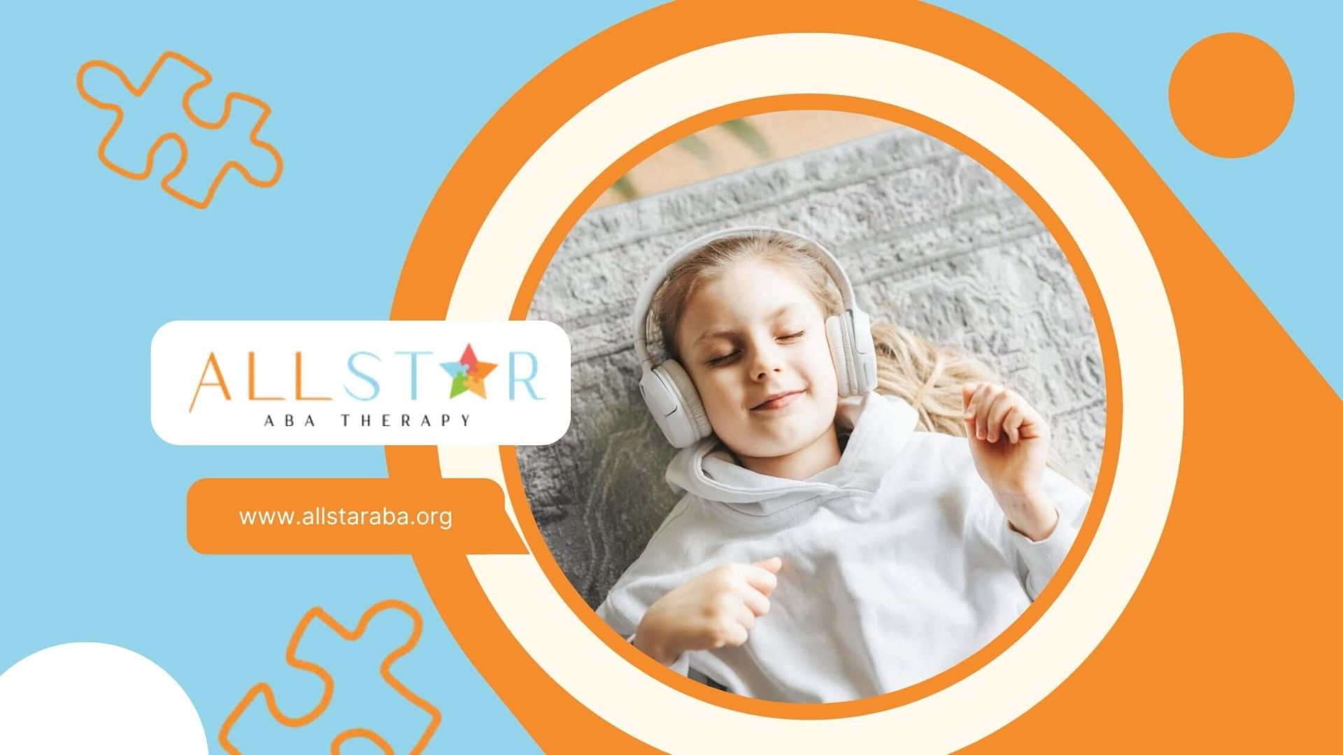 Young girl with autism lying on a rug, smiling and listening to music with headphones.