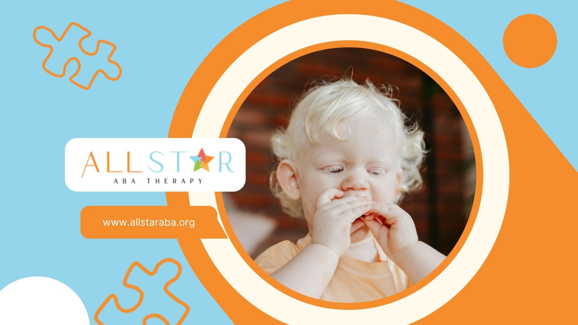 Autistic blonde toddler in orange shirt placing hands near mouth indoors during ABA therapy in MD.