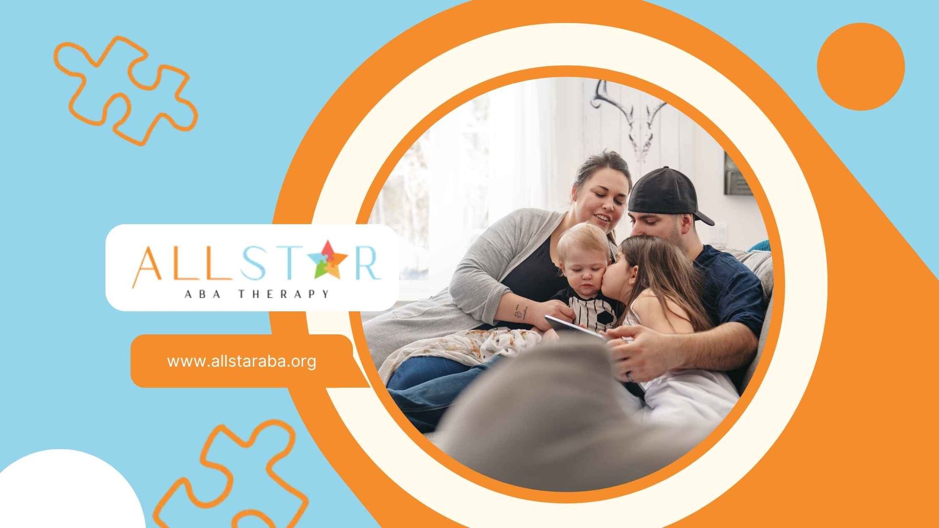 A family is sitting on a couch with two children.