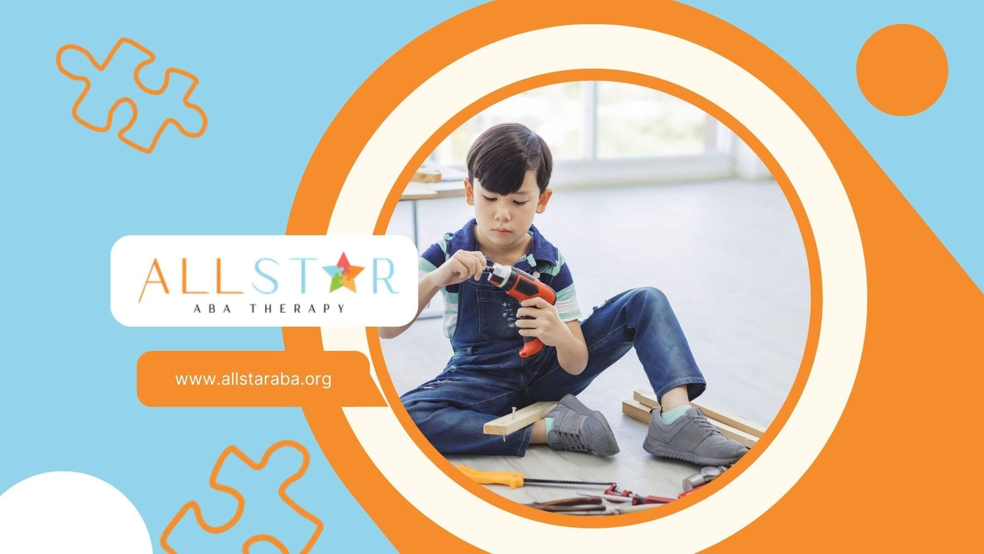 A boy sitting on the floor, using a small electric drill to play with wooden pieces after therapy.