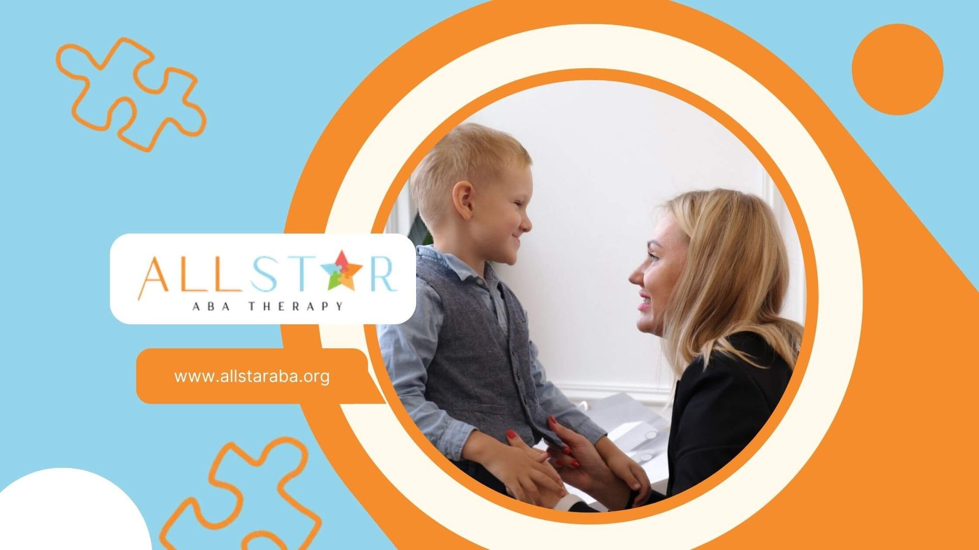 BCBA kneeling and talking to smiling young boy with autism.