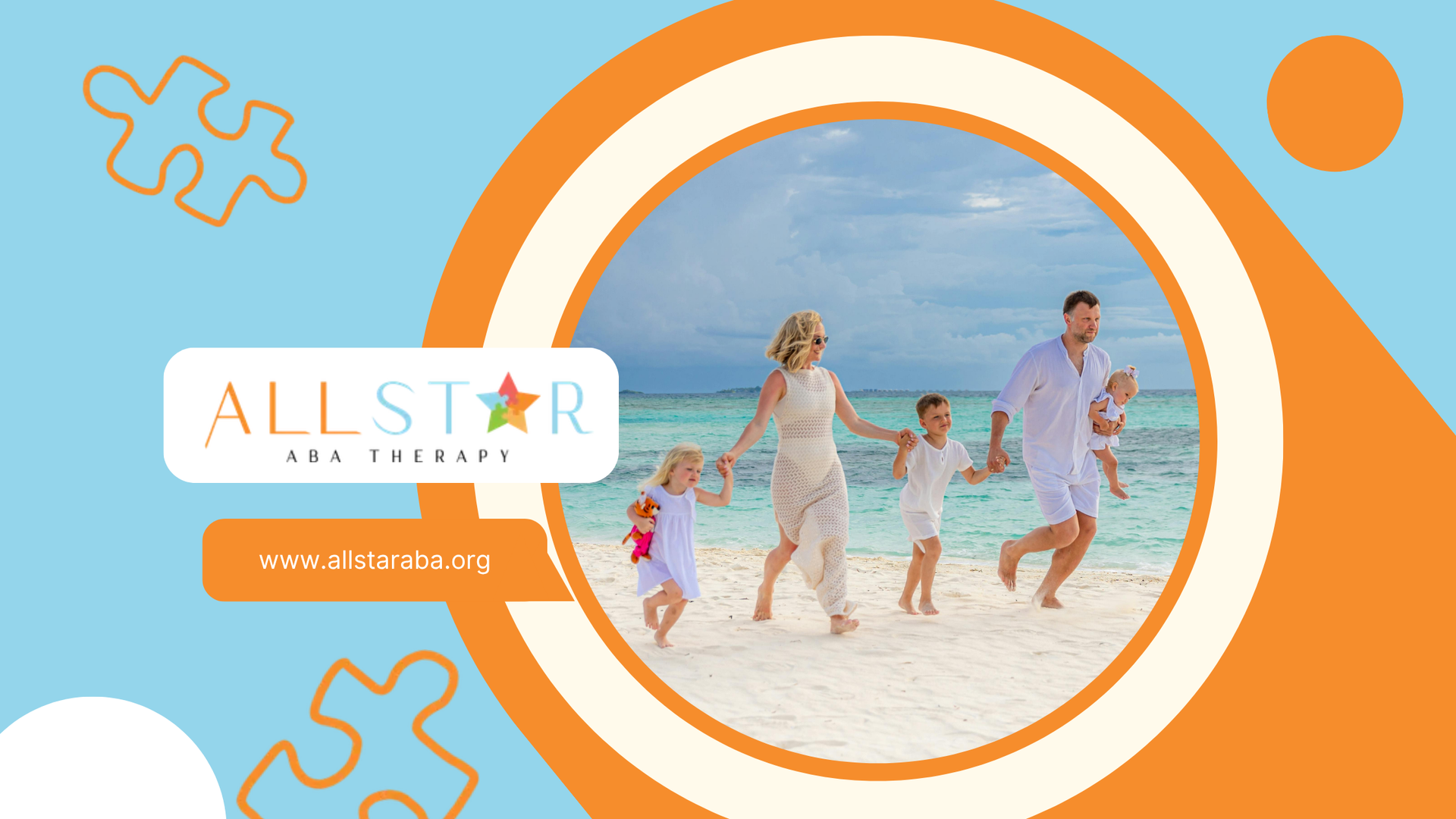 A family of five dressed in white walking hand-in-hand along a sandy beach with turquoise ocean wate