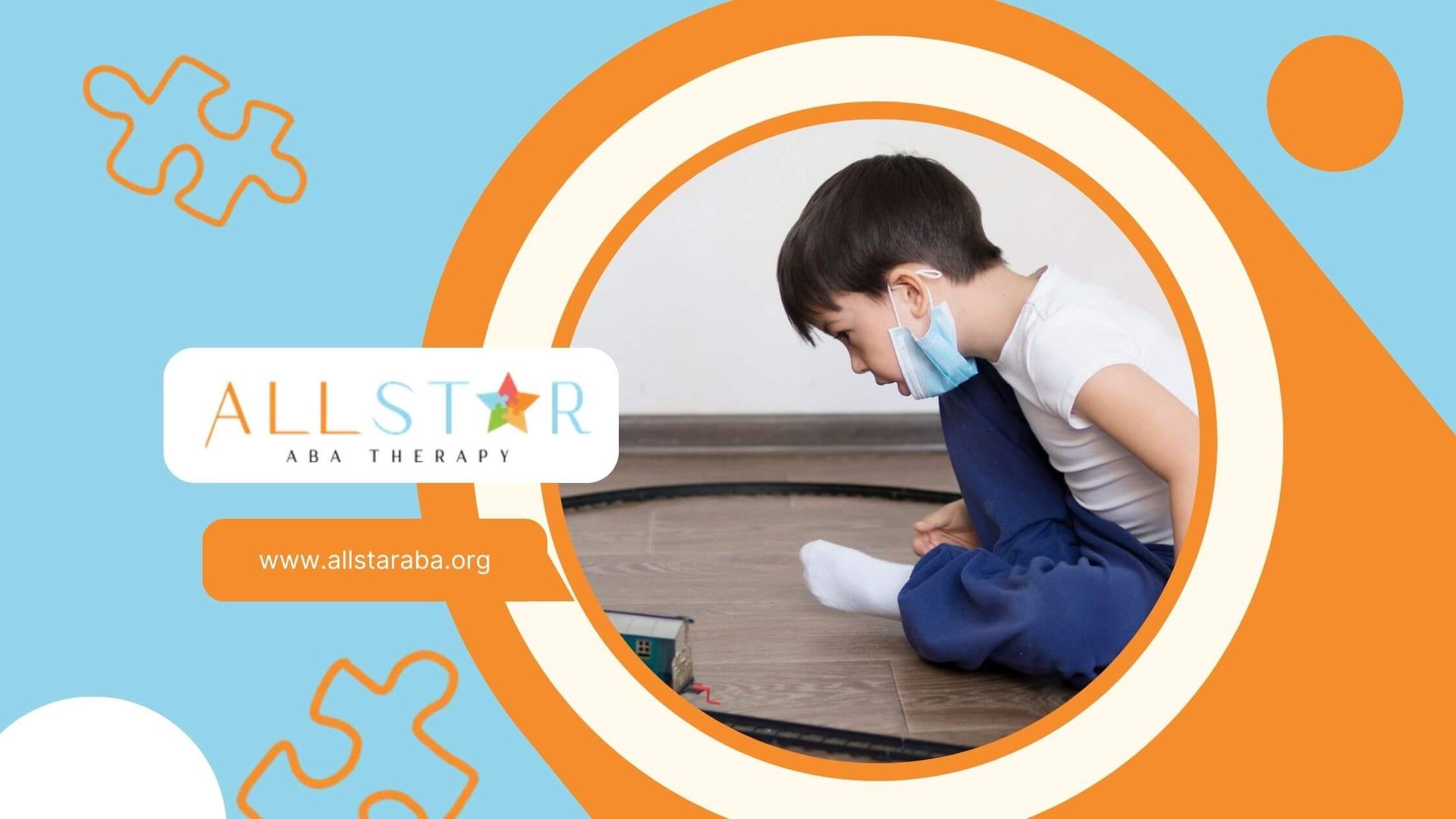 Autistic boy with a medical mask playing with a toy train set on the floor after ABA therapy.