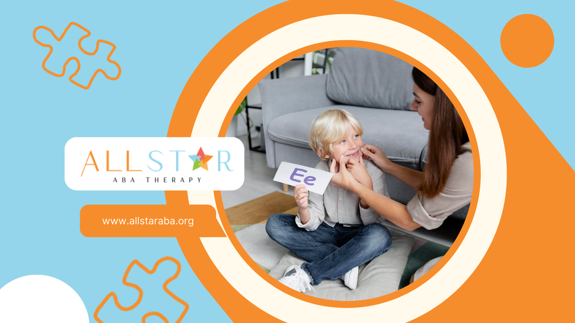 An RBT is sitting on the floor with an autistic child holding a flashcard.