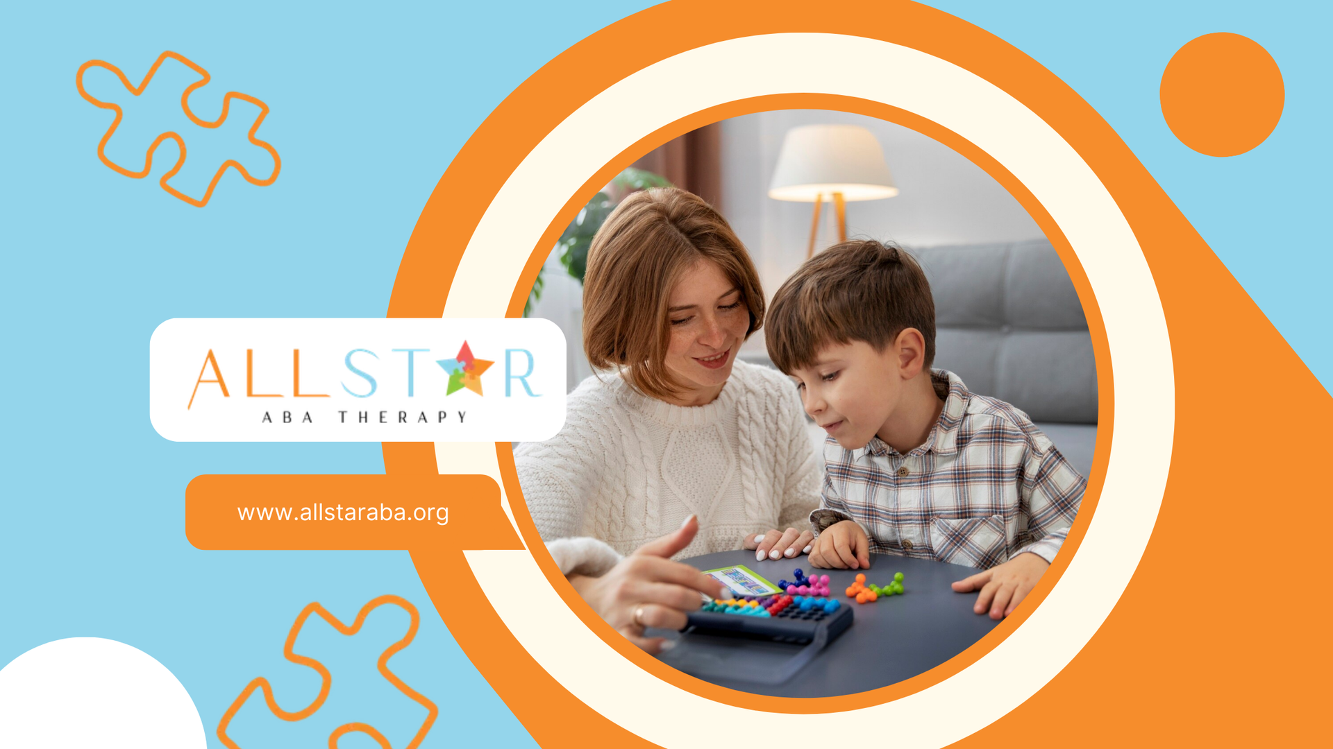 An RBT and a boy with autism are playing a game at a table.