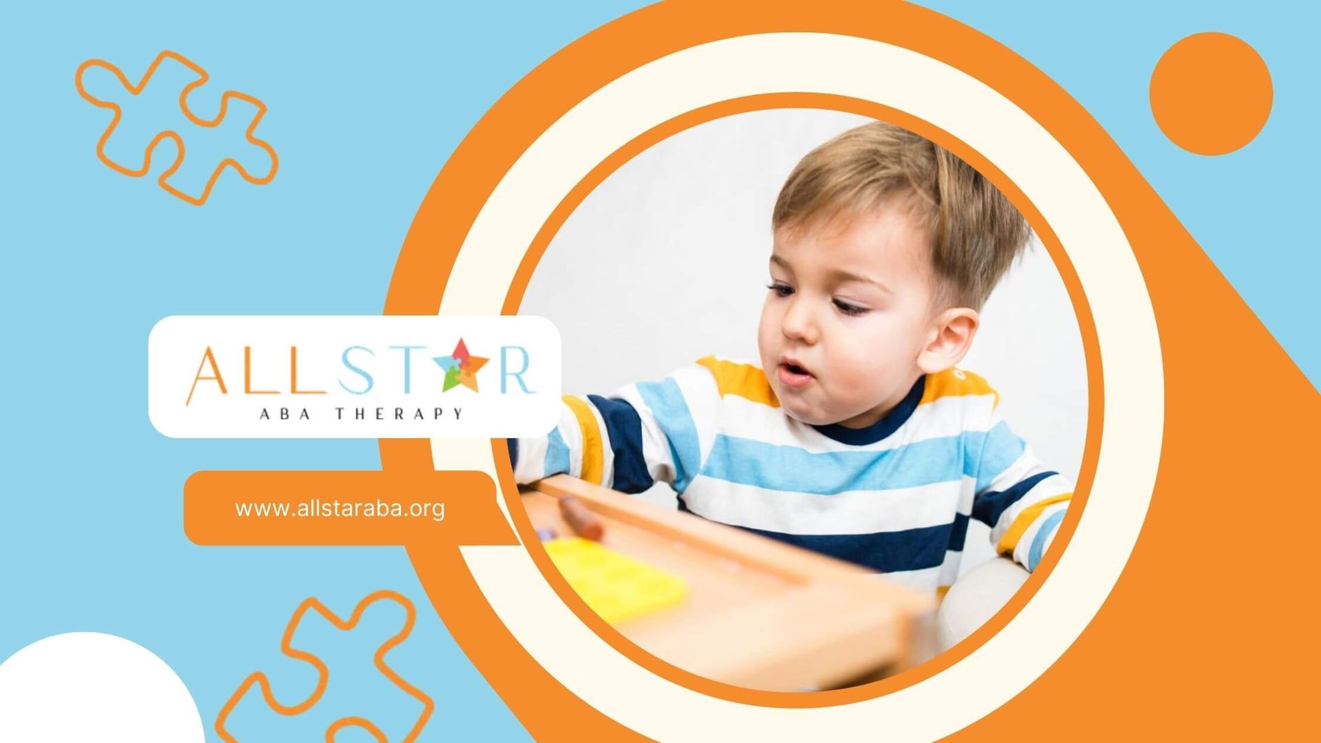 Young boy with autism coloring with crayons at a table in ABA therapy.