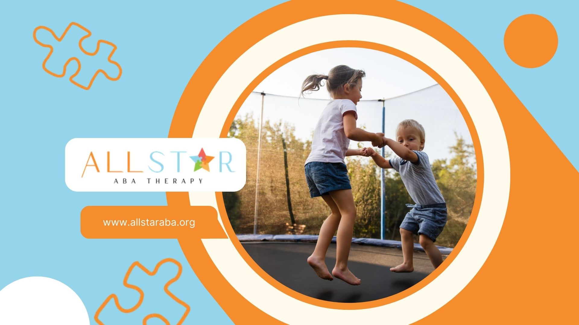 A boy and a girl are playing on a trampoline.