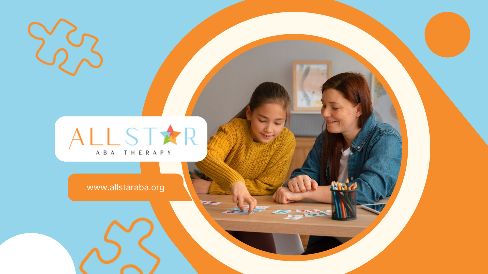 An RBT and a girl with autism are sitting at a table playing a game of puzzles.