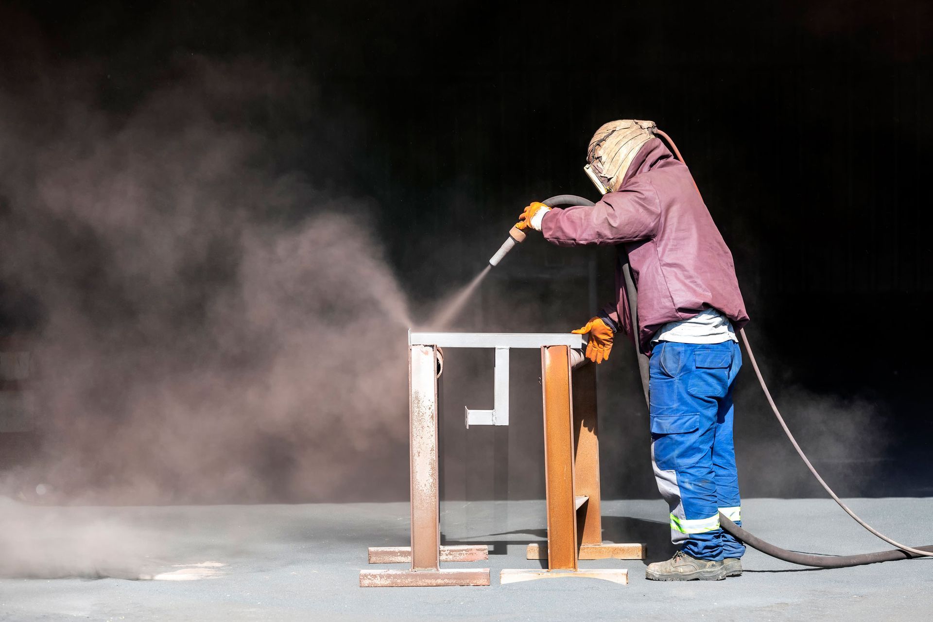 Sandblaster Is Sandblasting to Steel Material. | Mesa, AZ - Pecks Coating Supply