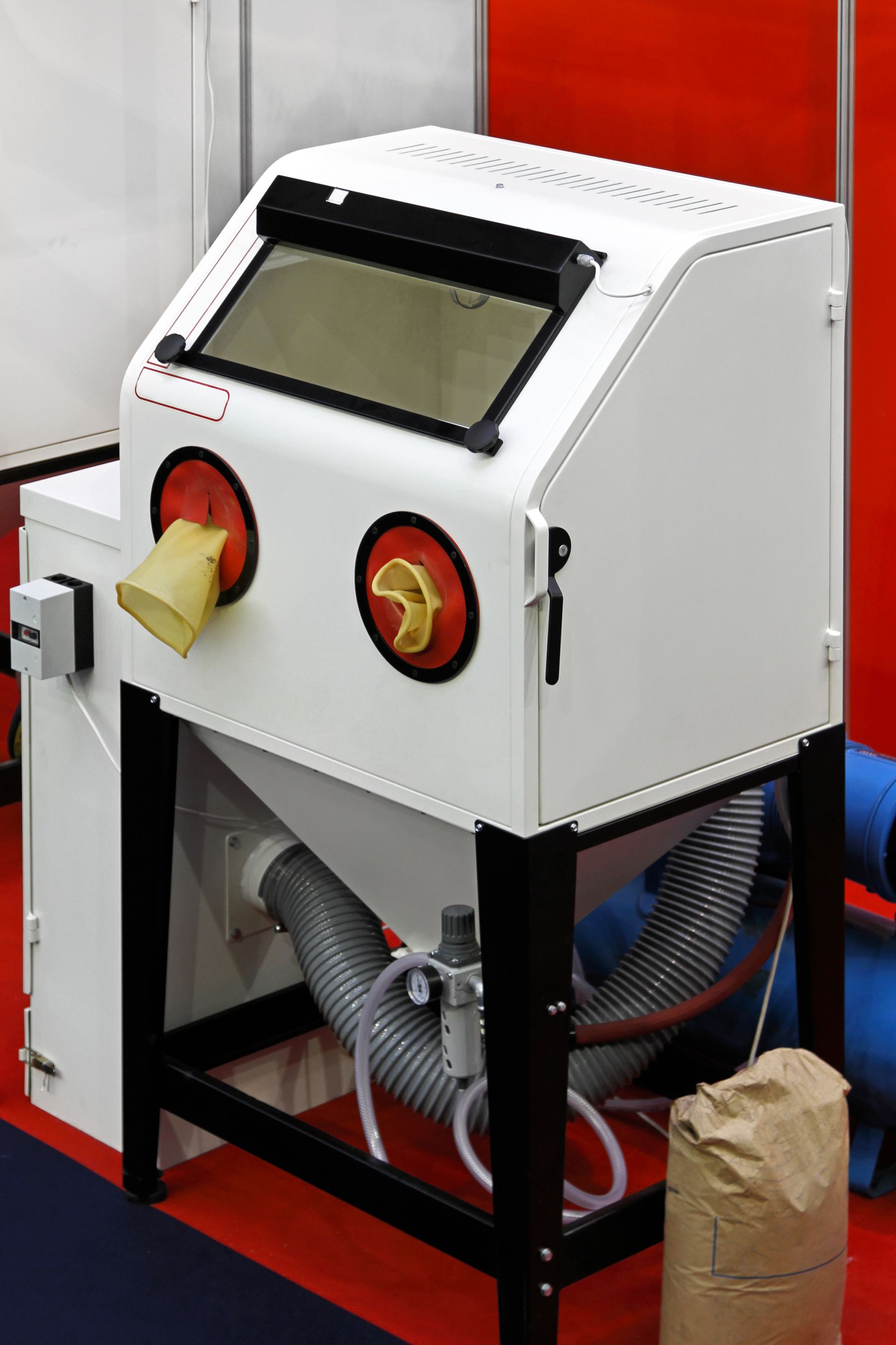 Sand blasting cabinet in metal work shop. Sand blasting cabinet in metal work shop.