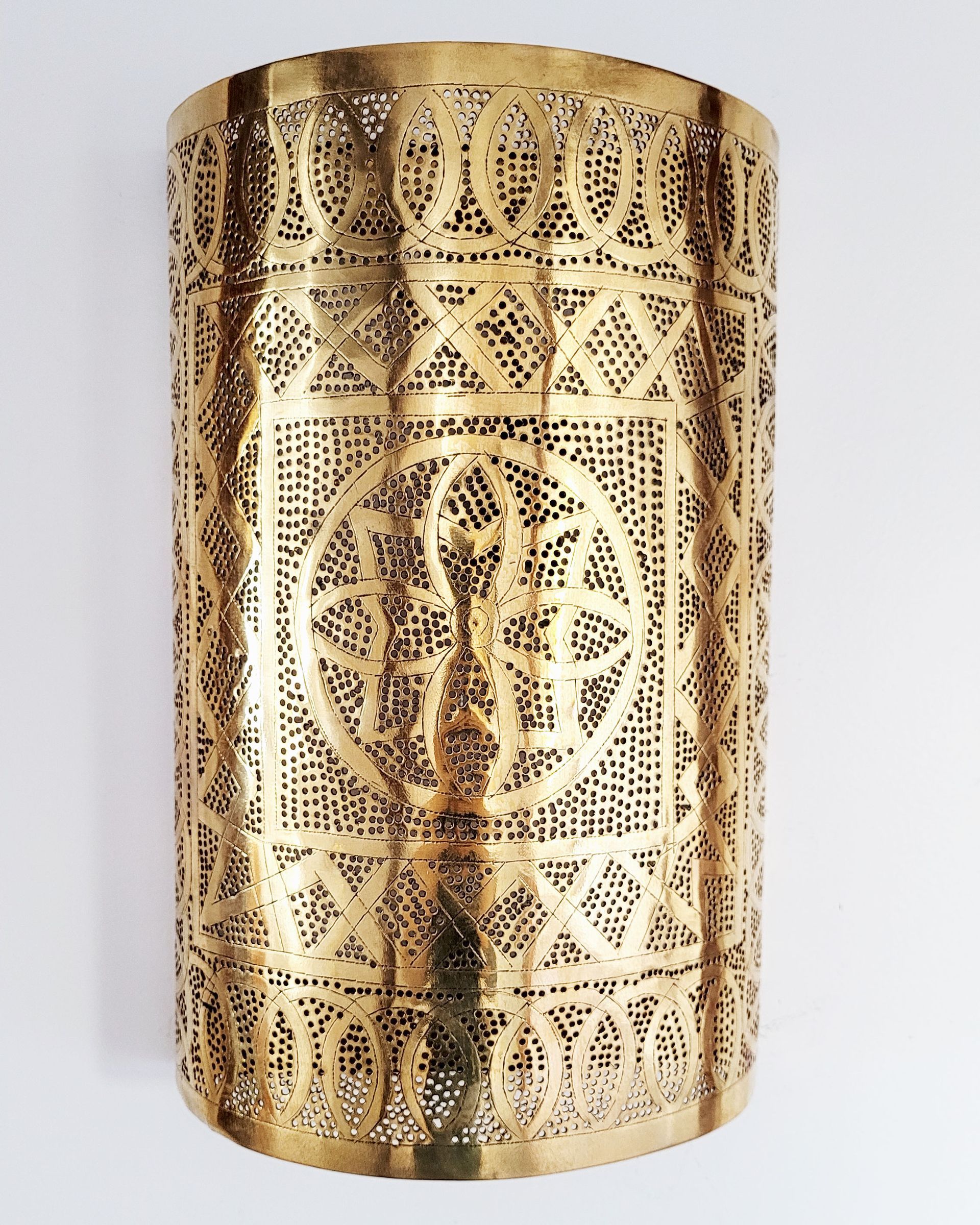 An antique copper lamp on a historic boat sailing the Nile. The boat is the Dahabiya Kingfisher, which was built in 1899 and offers private cruises between Luxor and Aswan in Egypt.