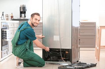 repair tech with refrigerator