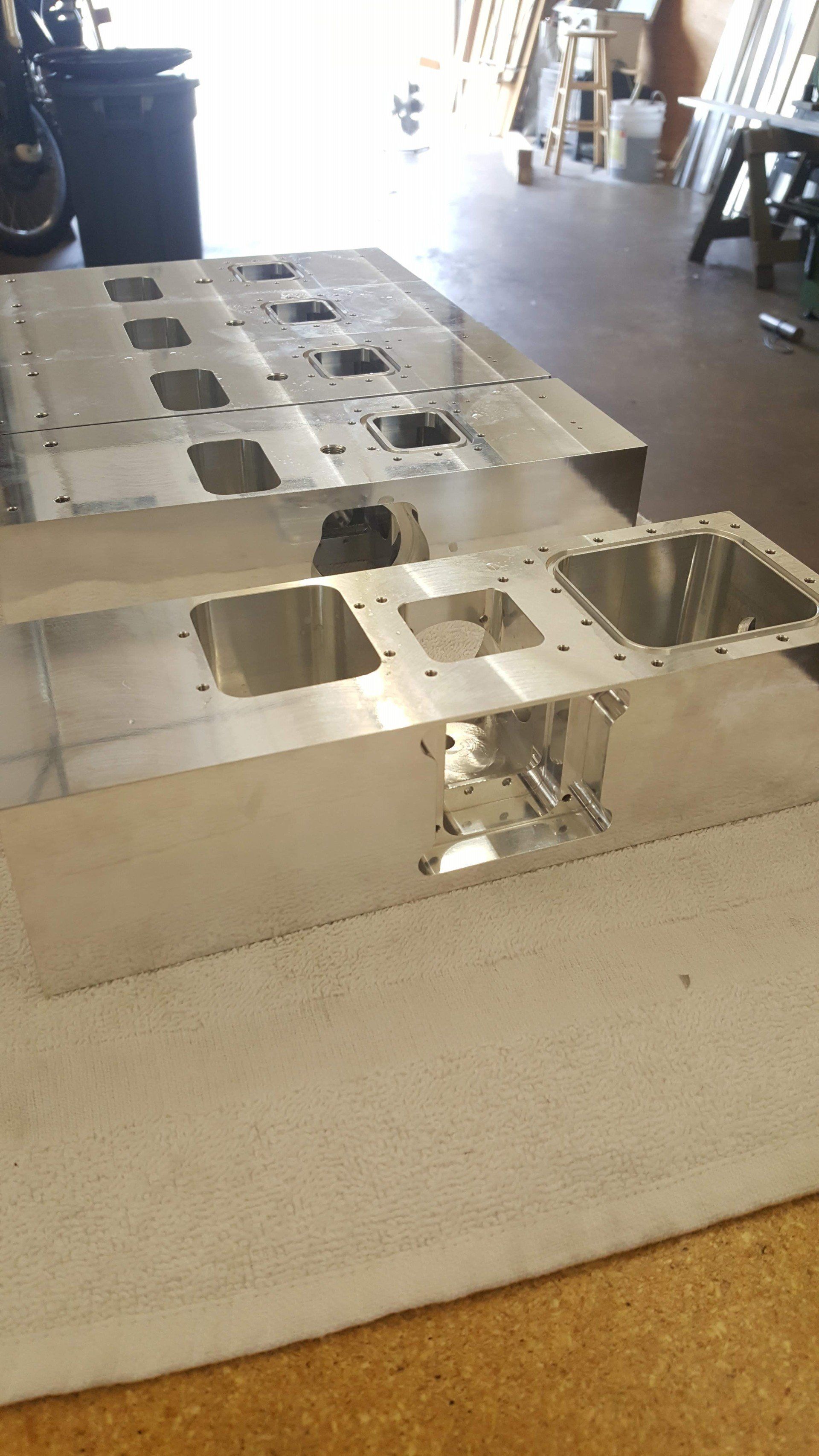 A stack of metal blocks sitting on top of each other on a table.