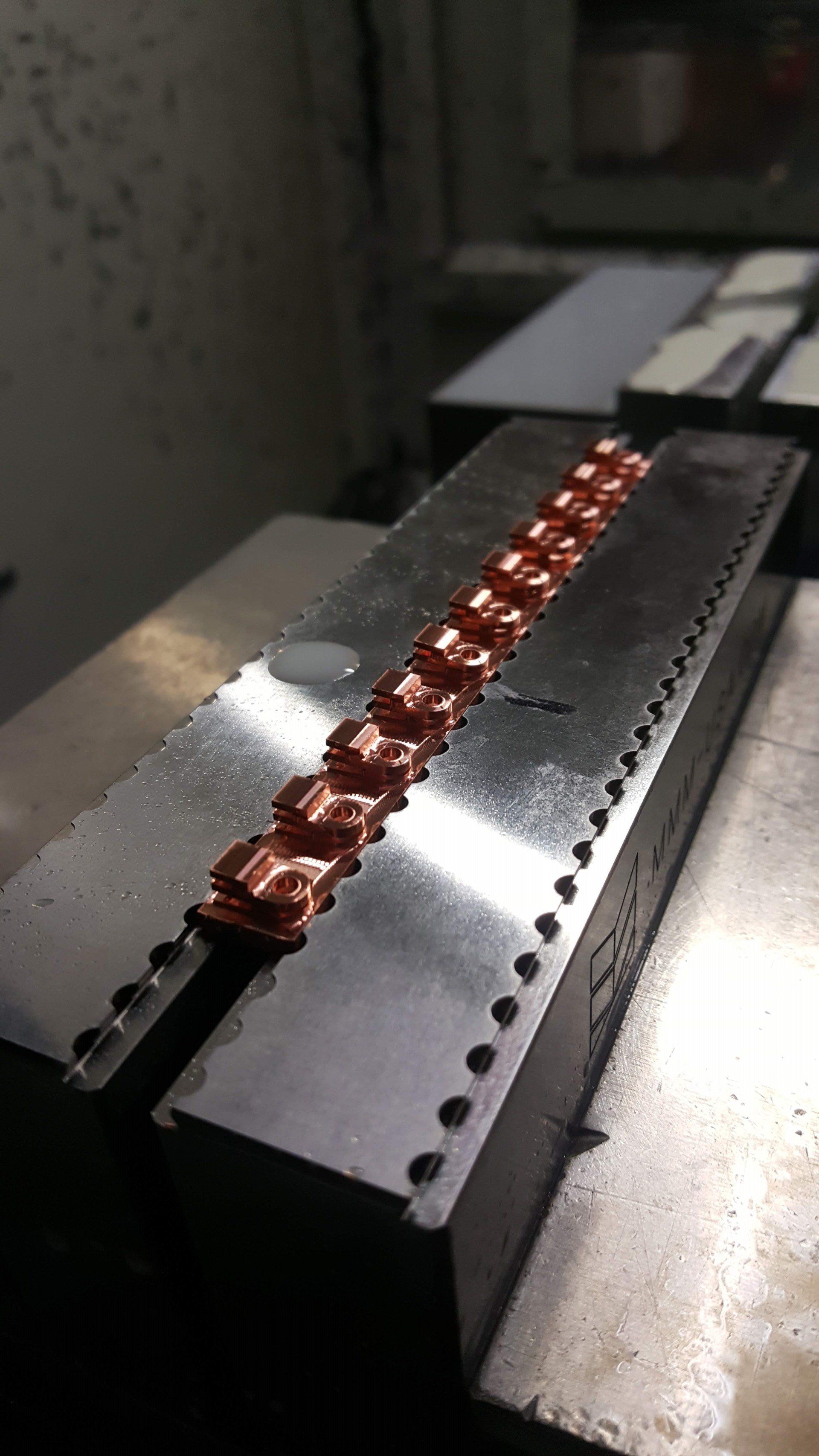 A close up of a piece of metal on a machine.