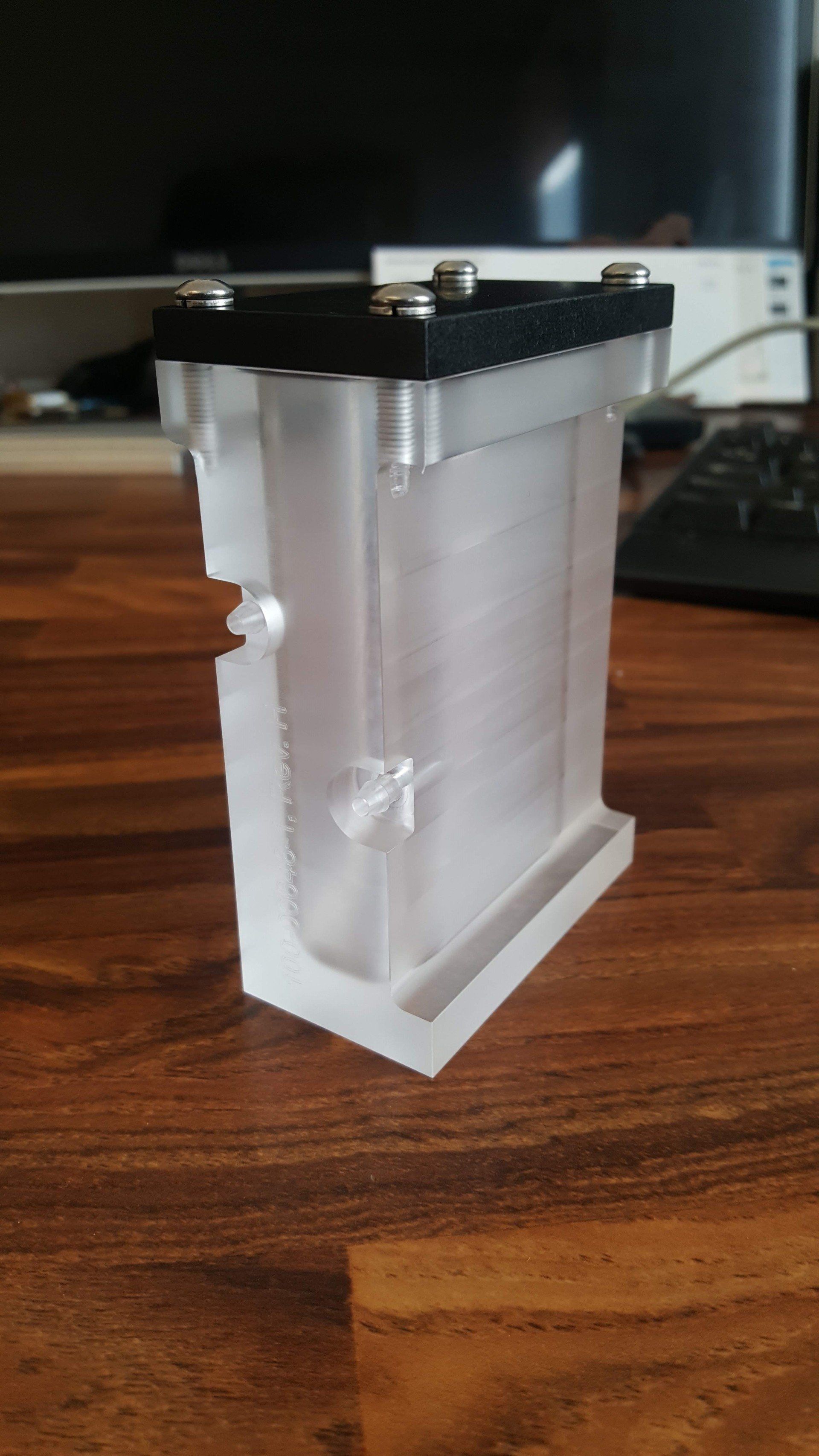 A clear plastic container is sitting on top of a wooden table.