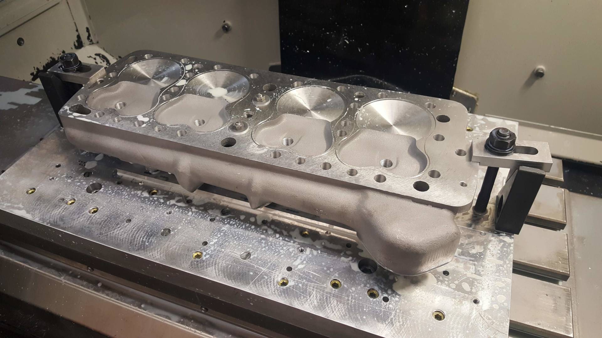 A piece of metal is sitting on top of a machine.