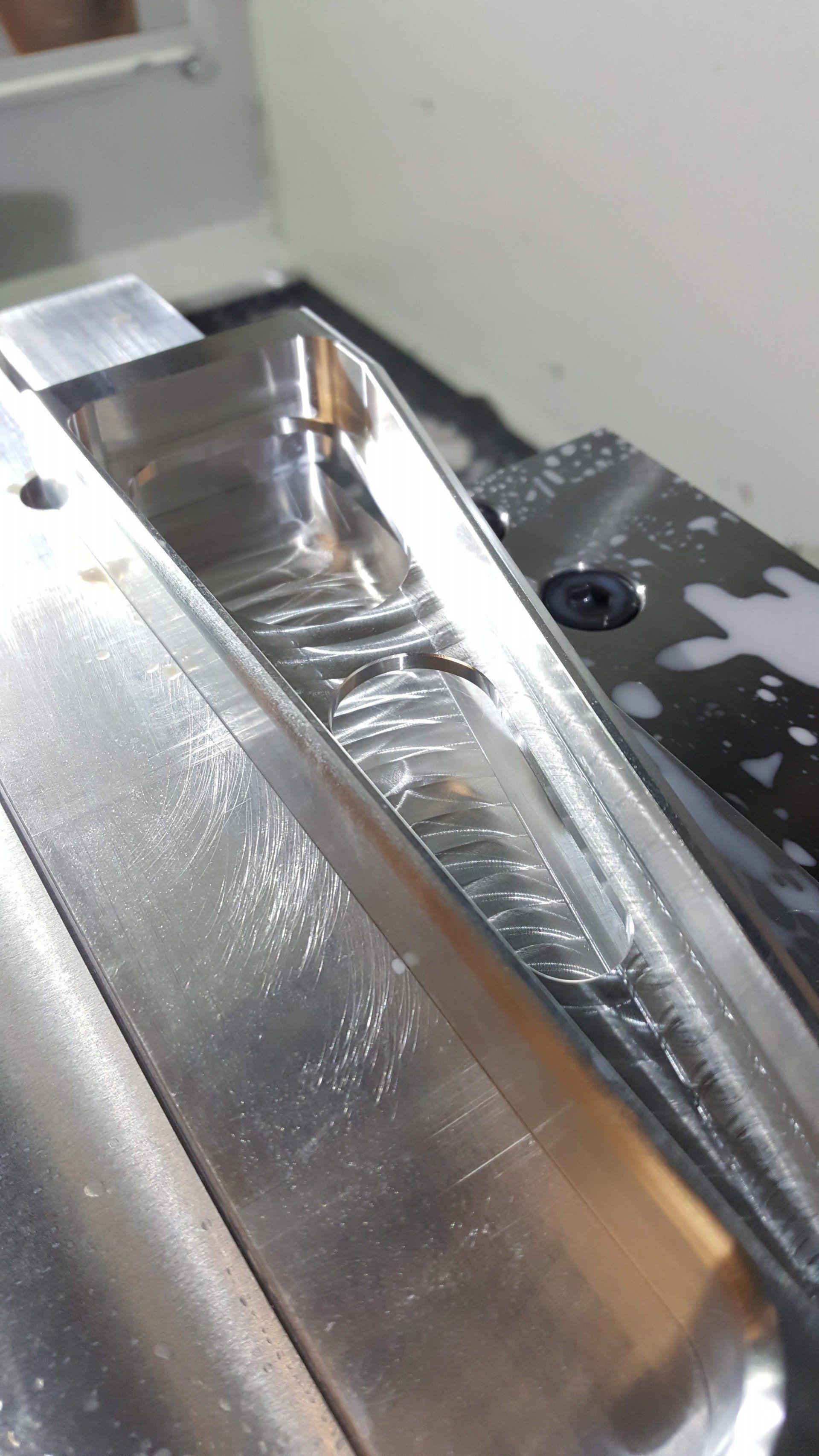 A close up of a metal object on a machine.