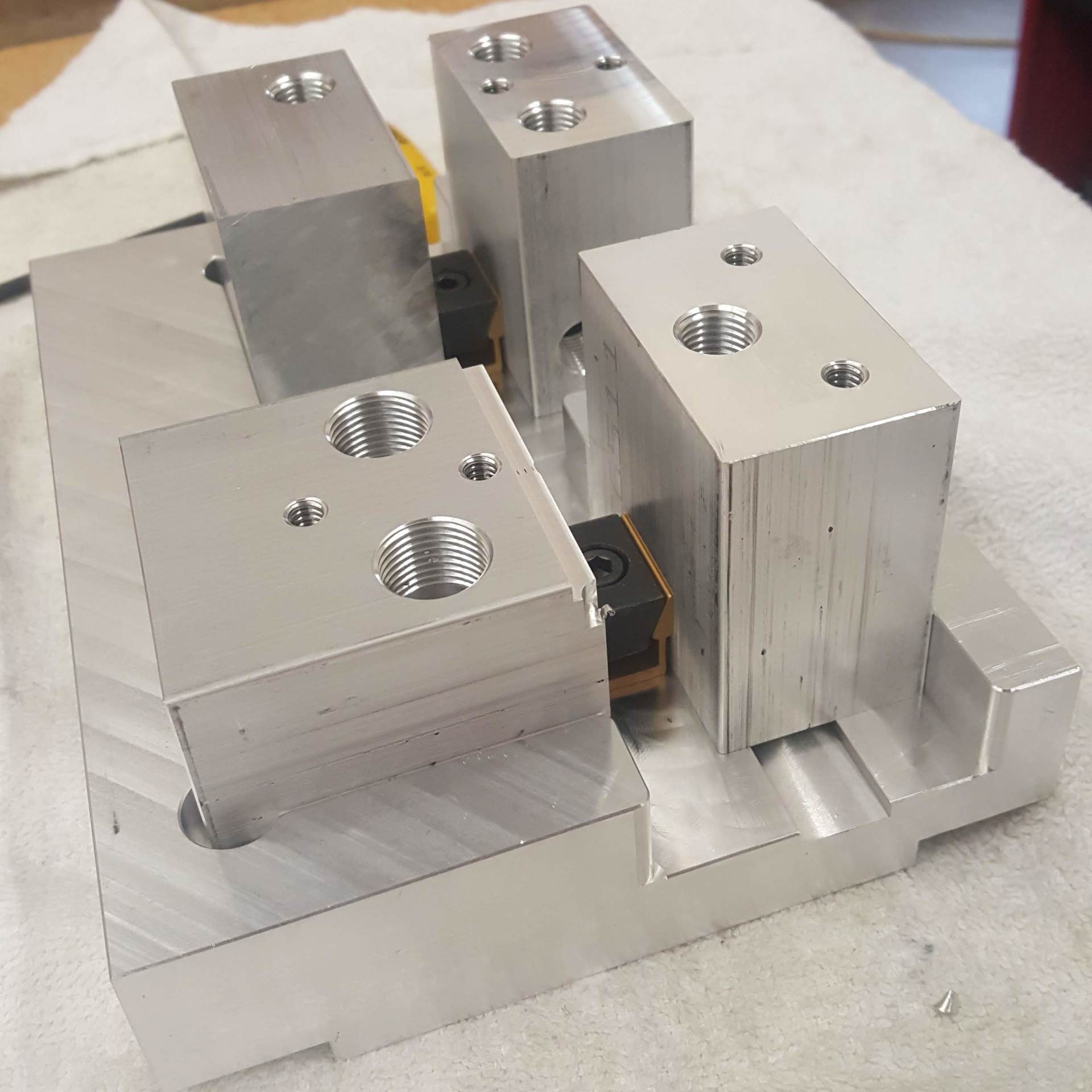 A piece of metal with holes in it is sitting on a table.