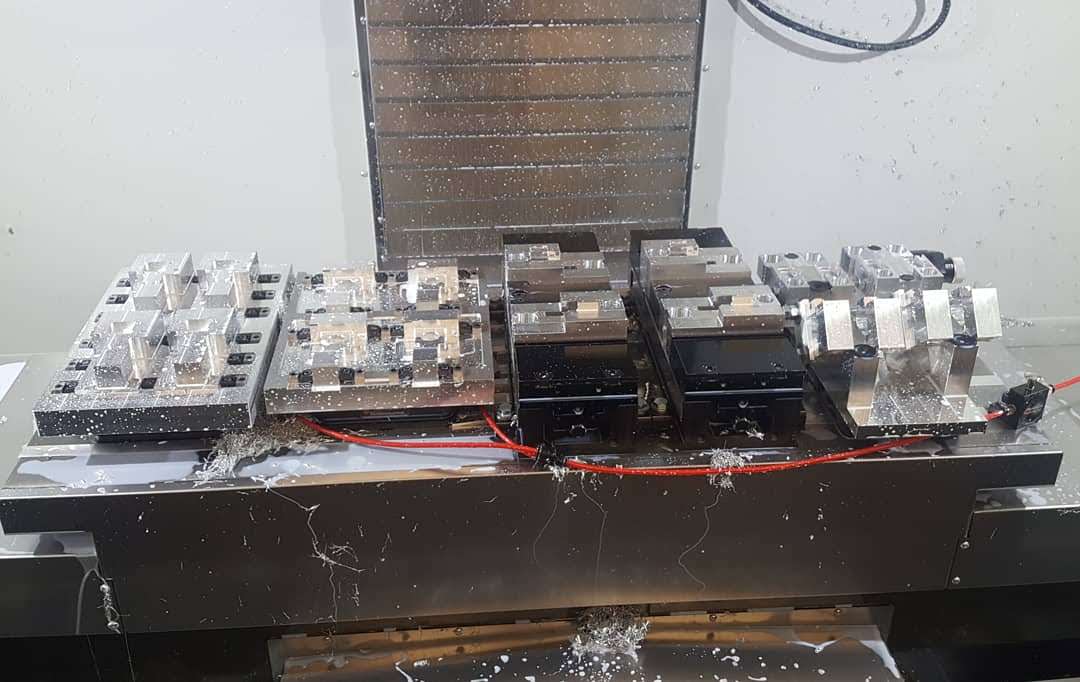 A machine is sitting on top of a table in a factory.