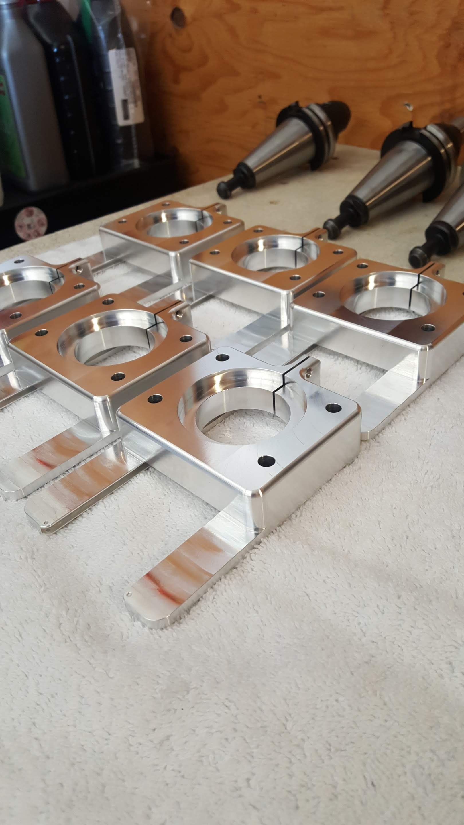 A bunch of metal pieces are sitting on a table.