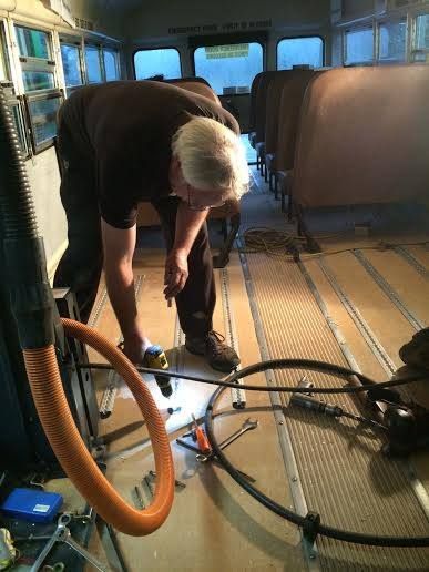 Our Mechanic Working on Bus Floor in Nanaimo, BC - Auto Check Automotive