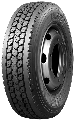 Truck tire on a metal rim with a detailed tread pattern, likely for commercial use.