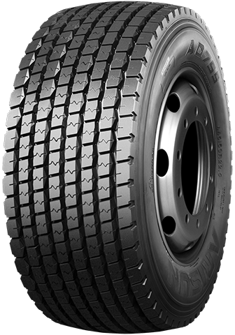 Black truck tire on a silver wheel, with deep tread pattern.