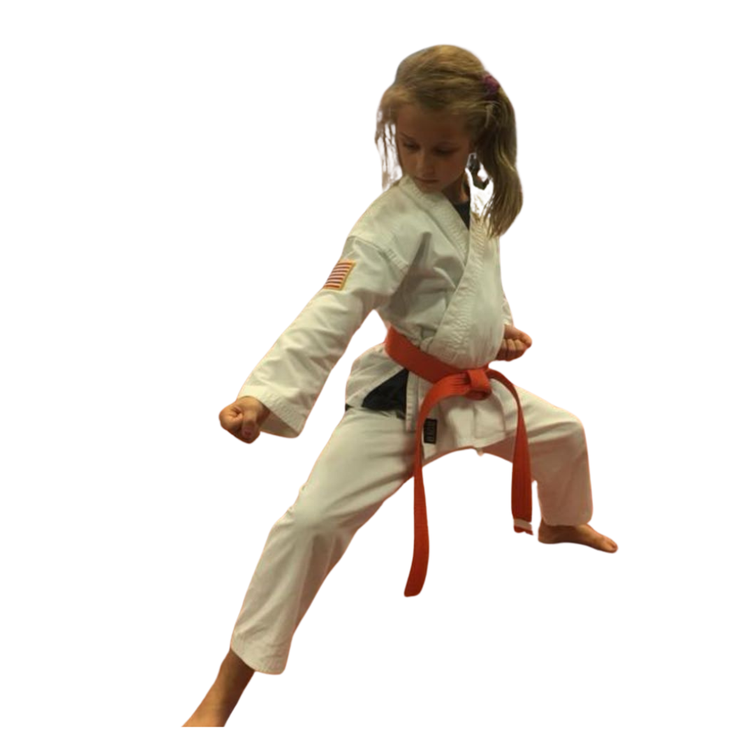 a group of children are practicing martial arts together .