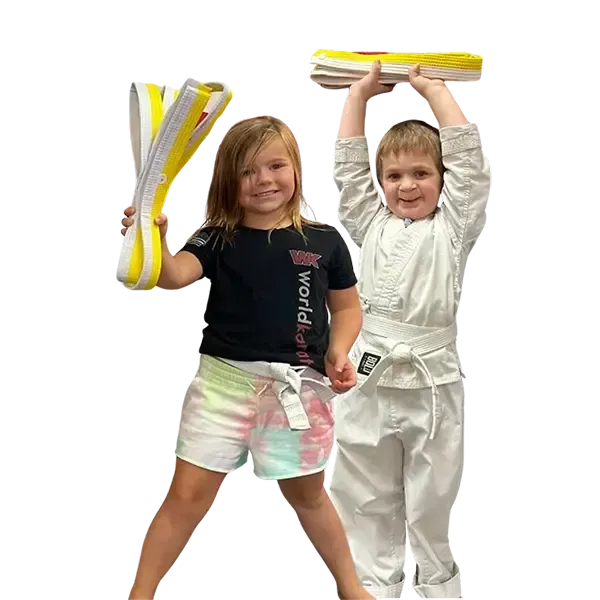 A boy and a girl are practicing karate together.