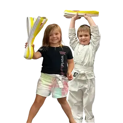 A boy and a girl are practicing karate together.