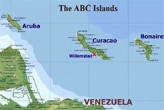 Map of the ABC Islands (Aruba, Curaçao, Bonaire) off the coast of Venezuela, labeled with island names and Willemstad.
