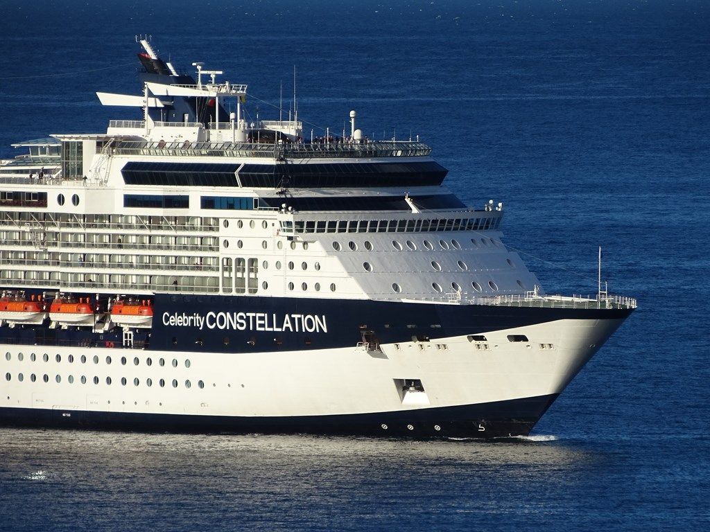 Cruise ship Celebrity Constellation sailing on blue water.